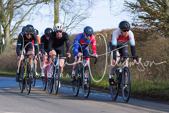 Lap 2 - a small chase group hunt down the lone leader