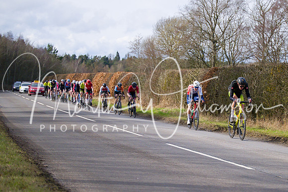 Lap 3 - the bunch is stretched as eventual winner Tom Martin (Wheelbase CabTech Castelli) shows himself