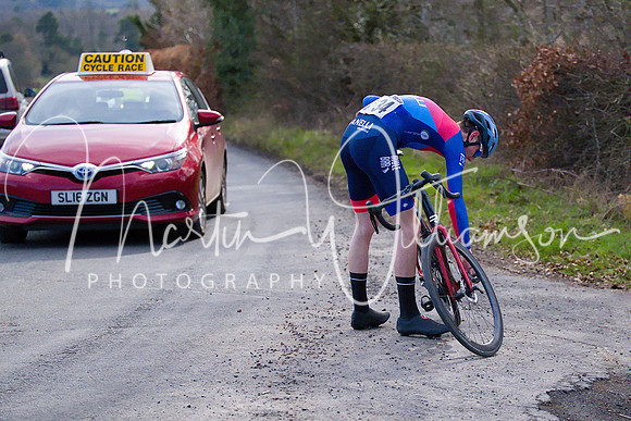 Lap 3 - Craig Paterson (Vanelli-Project GO) jumps off his bike and checks what's wrong; it's a loose crank